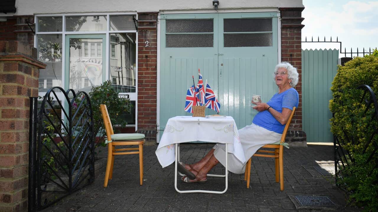 Nell from Wandsworth, London, takes to her front garden to celebrate a socially distanced street party on the 75th Anniversary of VE Day.
