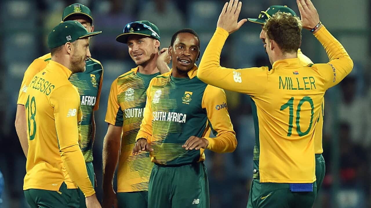 South Africa's Aaron Phangis(C)celebrates the wicket of Sri Lanka's batsman Lahiru Thirimanne with teammates