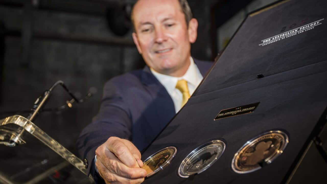 WA Premier Mark McGowan unveils a coin collection at the Perth Mint