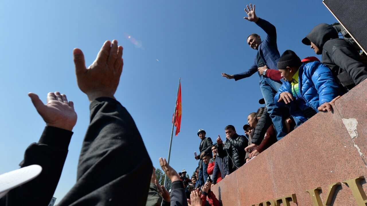 People protest during a rally on the central square in Bishkek, Kyrgyzstan on 7 October.