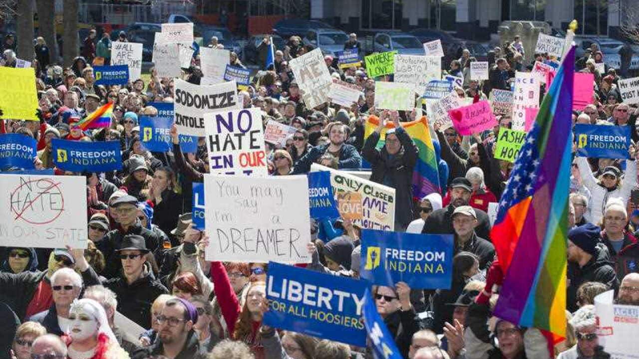 Thousands of opponents of Indiana Senate Bill 101, the Religious Freedom Restoration Act, gathered on the lawn of the Indiana State House to rally against that legislation Saturday, March 28, 2015 (AAP)