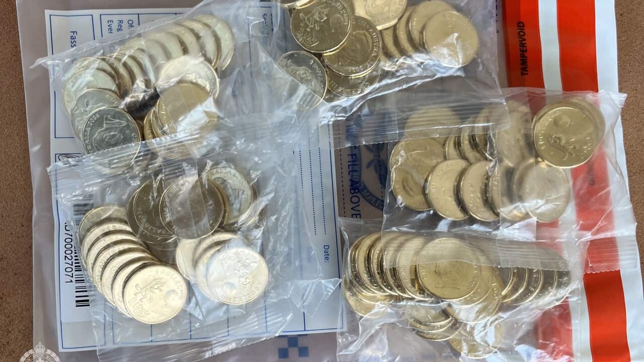 Several bags filled with gold coins.