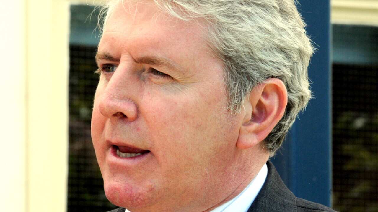 Minister sorry over Abbott 'stunt' remark