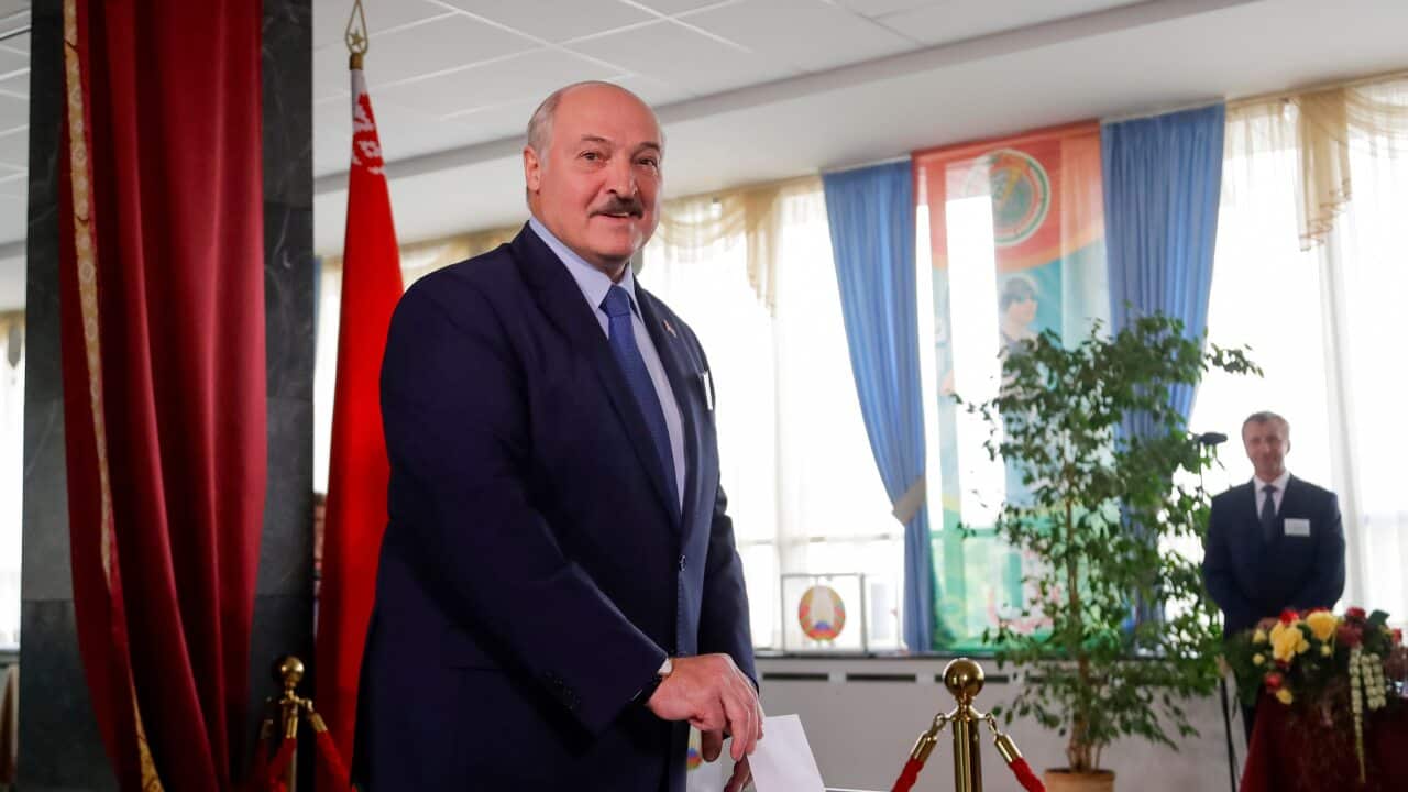 Belarusian President Alexander Lukashenko casts his ballot at a polling station during the presidential election in Minsk, Belarus, Sunday.