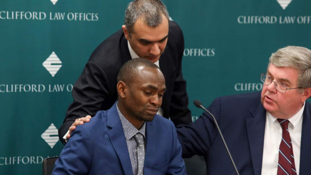 Paul Njoroge, left, who lost his wife and three young children in the crash of an Ethiopian Airlines' Boeing 737 Max, is comforted by Manant Vaidya.