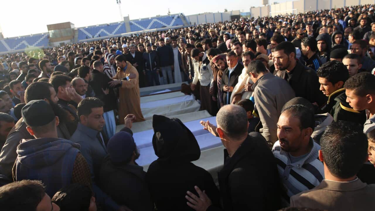 People attend a funeral of policemen killed in a truck bomb at a police base in the western Libyan town of Zliten on Thursday,Jan. 7, 2016.