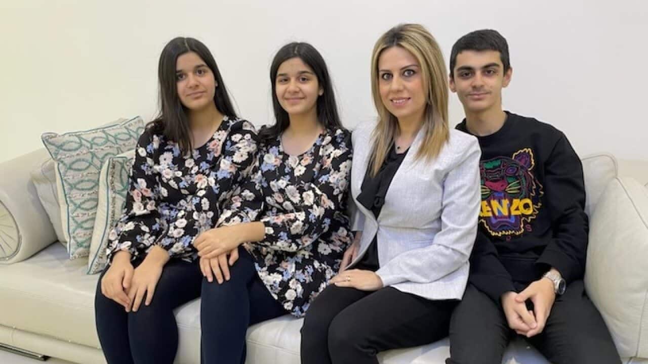 Rasha Daniel (third from left) with her three children