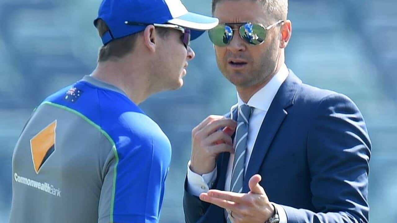 Former captain Michael Clarke (R) speaks with captain Steve Smith