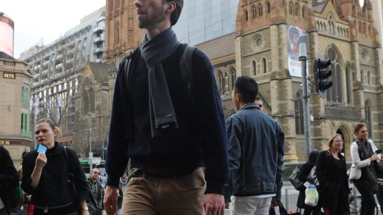 A file image of people walking on Flinders Street, Melbourne.