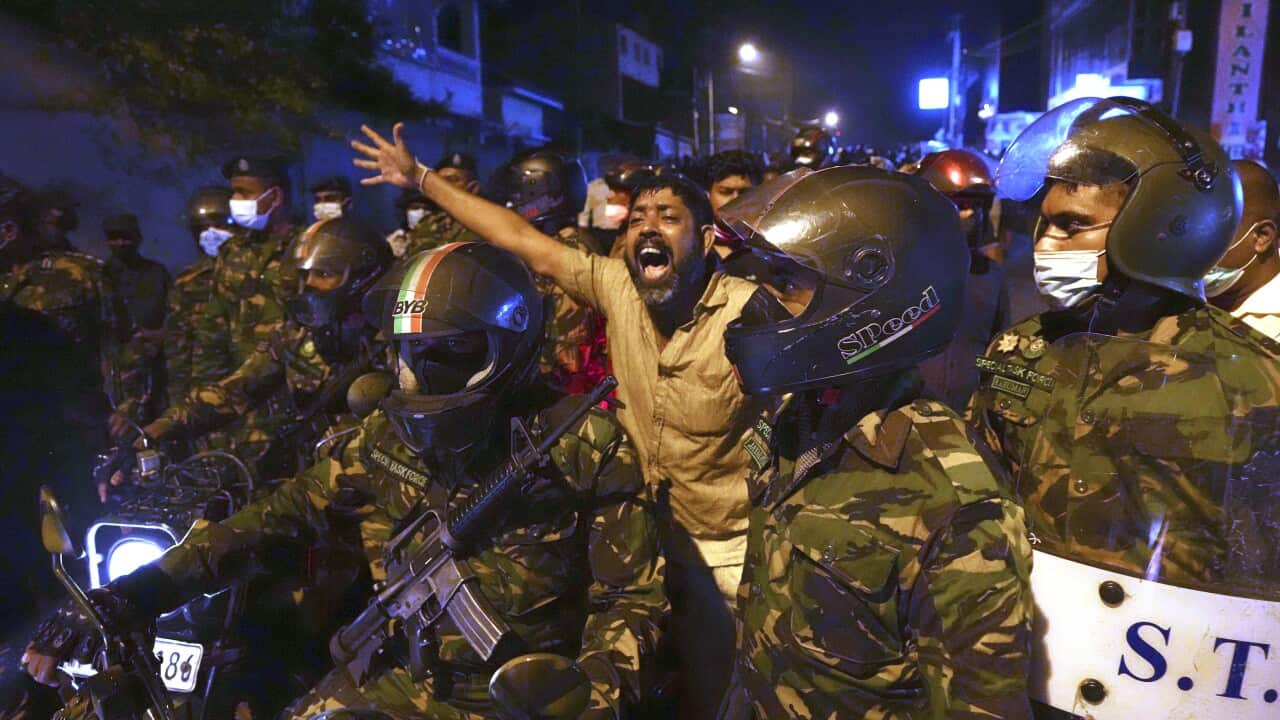 A Sri Lankan man shouts anti-government slogans during a protest outside the Sri Lankan president's private residence on the outskirts of Colombo, Sri Lanka.
