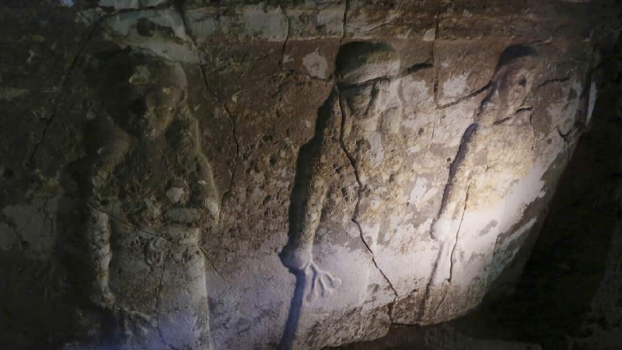Ancient artefacts are seen inside a tunnel under rubble in Mosul