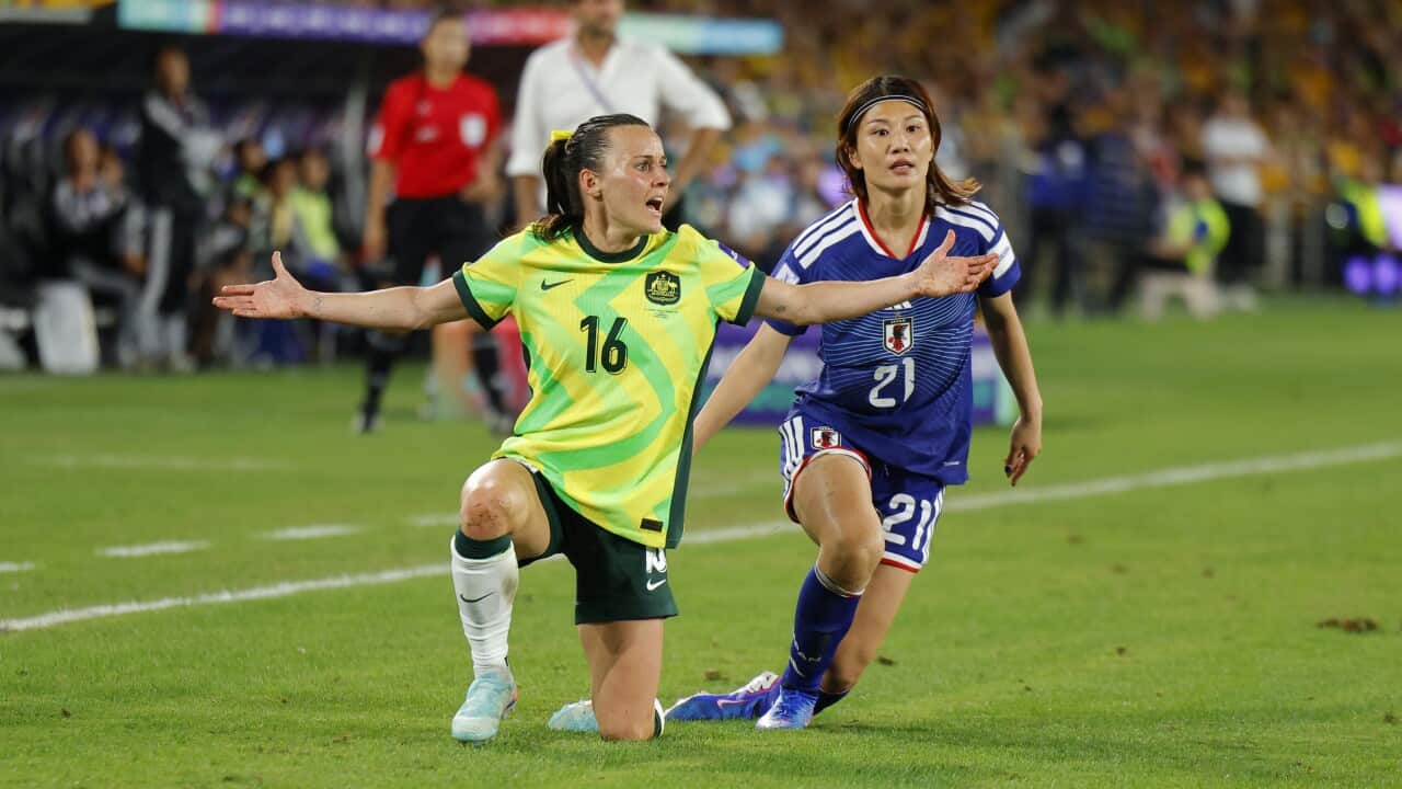 Hayley Raso protests a foul during the Women's Asian Cup final against in 2026. Her arms are spread wide, an annoyed look on her face.