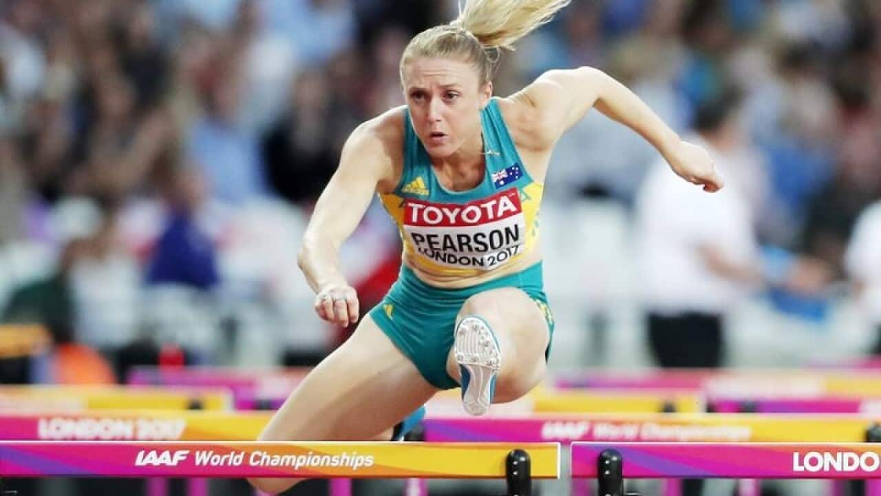 Australia's Sally Pearson clears a hurdle.