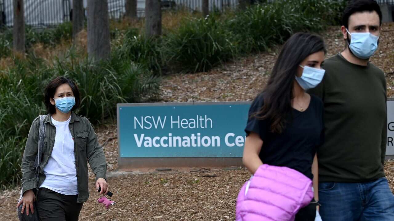 Members of the public line up at the NSW Health Vaccination Hub at Sydney's Olympic Park (AAP)