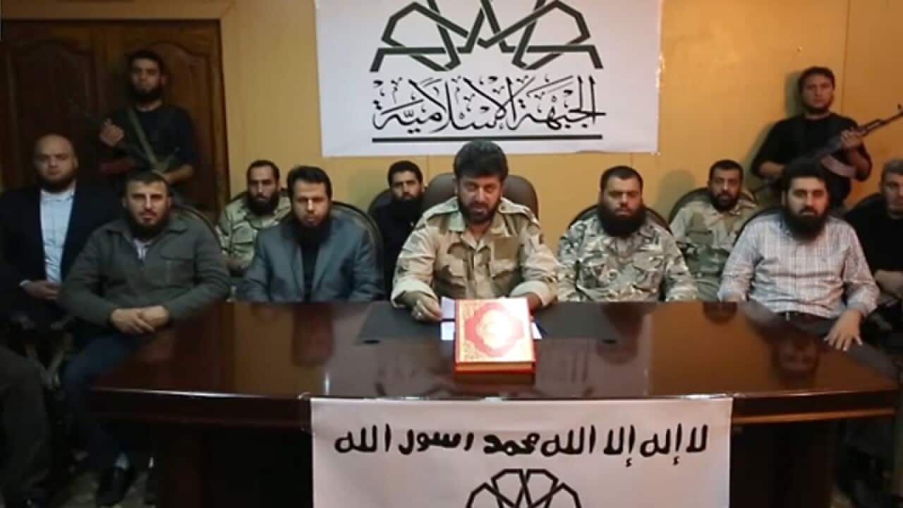 Rebel fighters announcing the creation of the "Islamic Front"