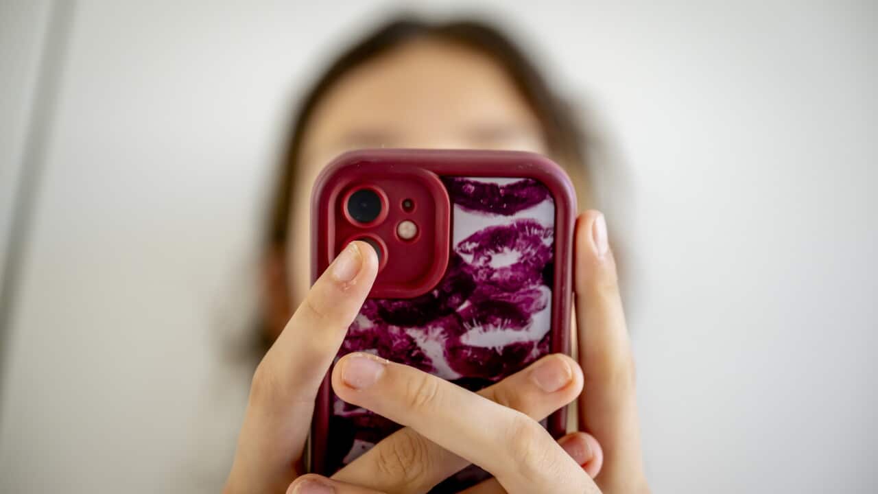 A teenage girl on her cell phone