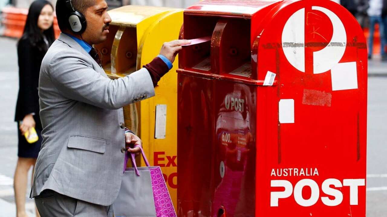 A man posts a letter