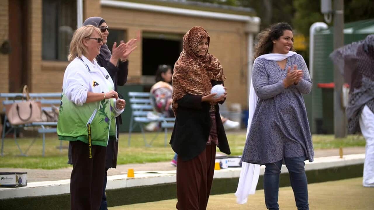 Migrant and refugee women enjoying lawn bowls