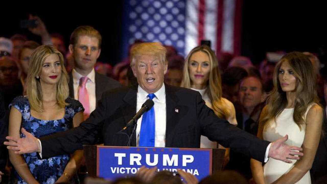 Republican presidential candidate Donald Trump is joined by his wife Melania, right, daughter Ivanka, left, and son Eric, background left