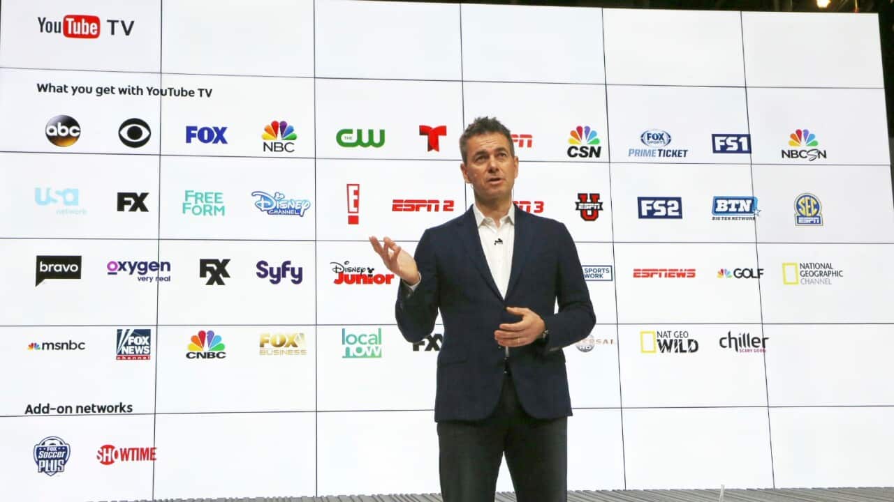 Chief Business Officer Robert Kuncl, with a graphic showing the many networks that will be carried, speaks during the introduction of YouTube TV