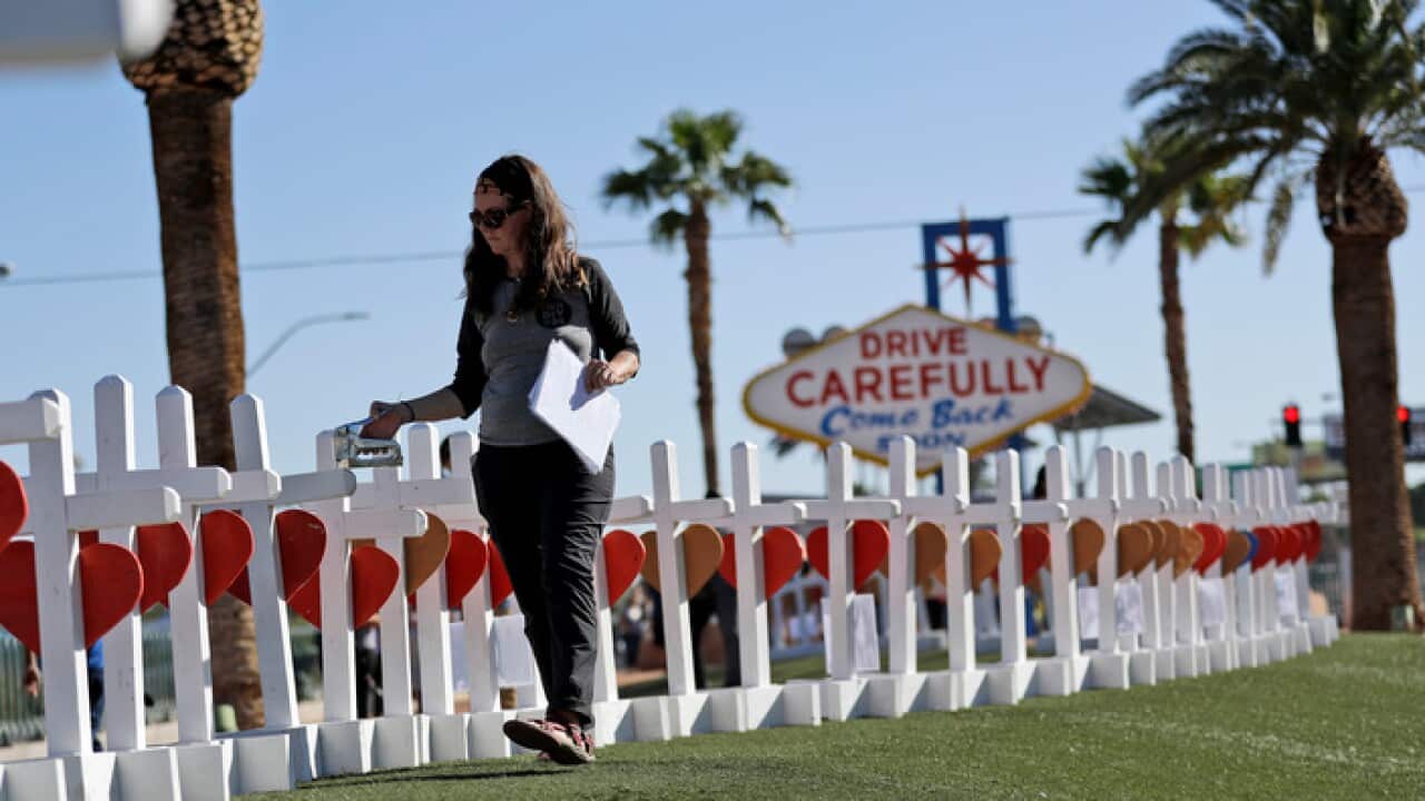 Arranging crosses in Las Vegas to honour the shooting victims