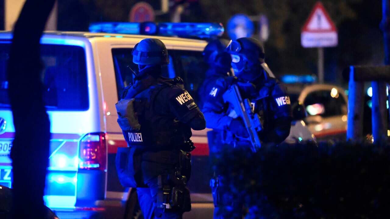 Police special forces patrol after a shooting near the Stadttempel synagogue in Vienna, Austria, 2 November 2020.
