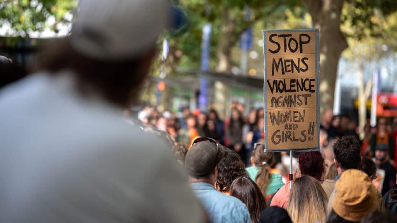 A sign reads 'Stop Men's Violence Against Women and Girls' during a rally for Isla Bell at the State Library of Victoria in Melbourne, Saturday, May 16, 2026 (AAP Image-Jay Kogler) .jpg