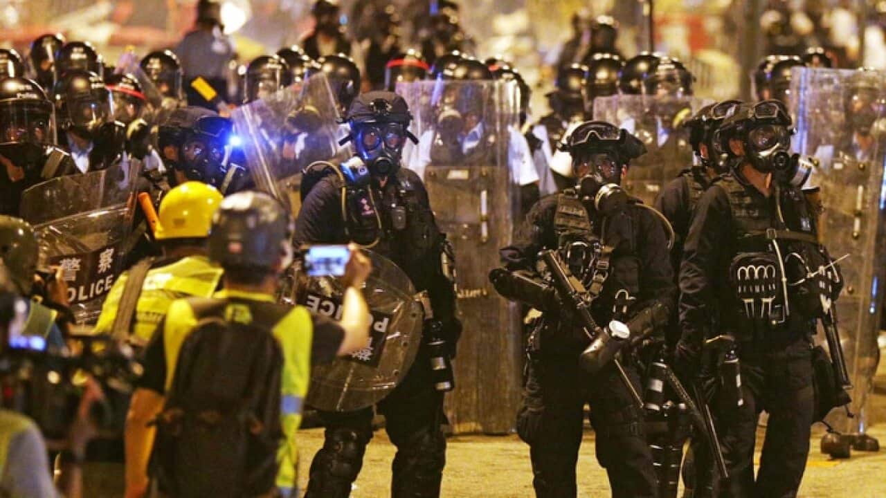 Police officers remove demonstrators from Hong Kong Legislative Council