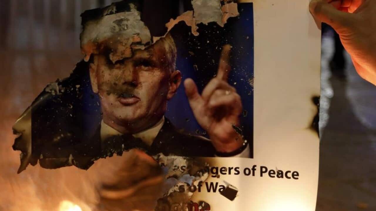 Palestinians burn posters of US Vice President Mike Pence