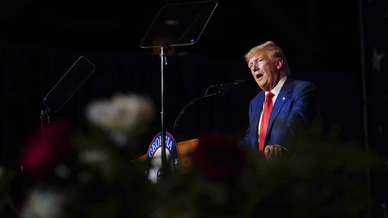 Donald Trump speaks at a podium at a Georgia Republican Convention