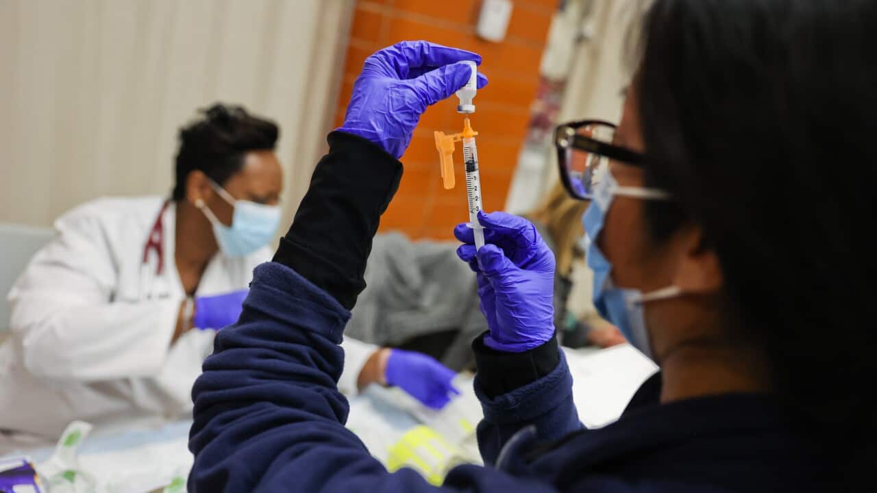 Doctor prepars pediatric doses of Covid-19 vaccine on Long Island