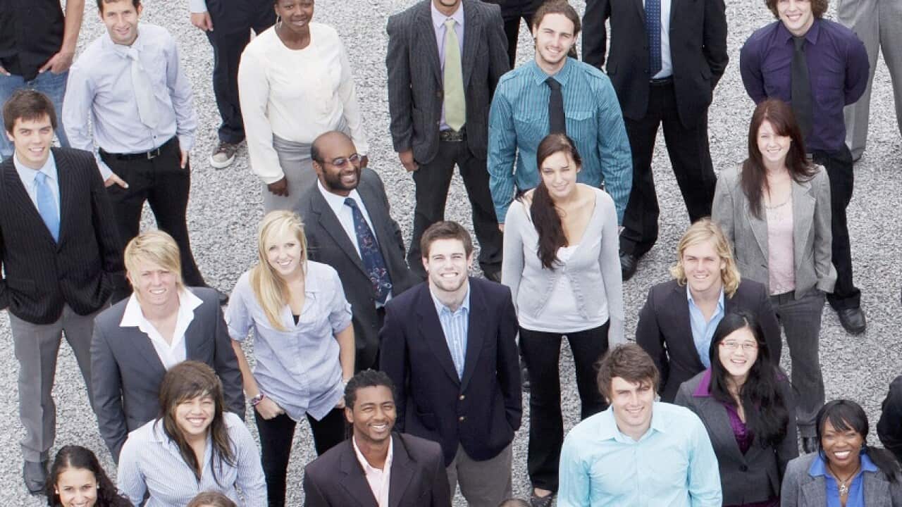 Portrait of business people in crowd
