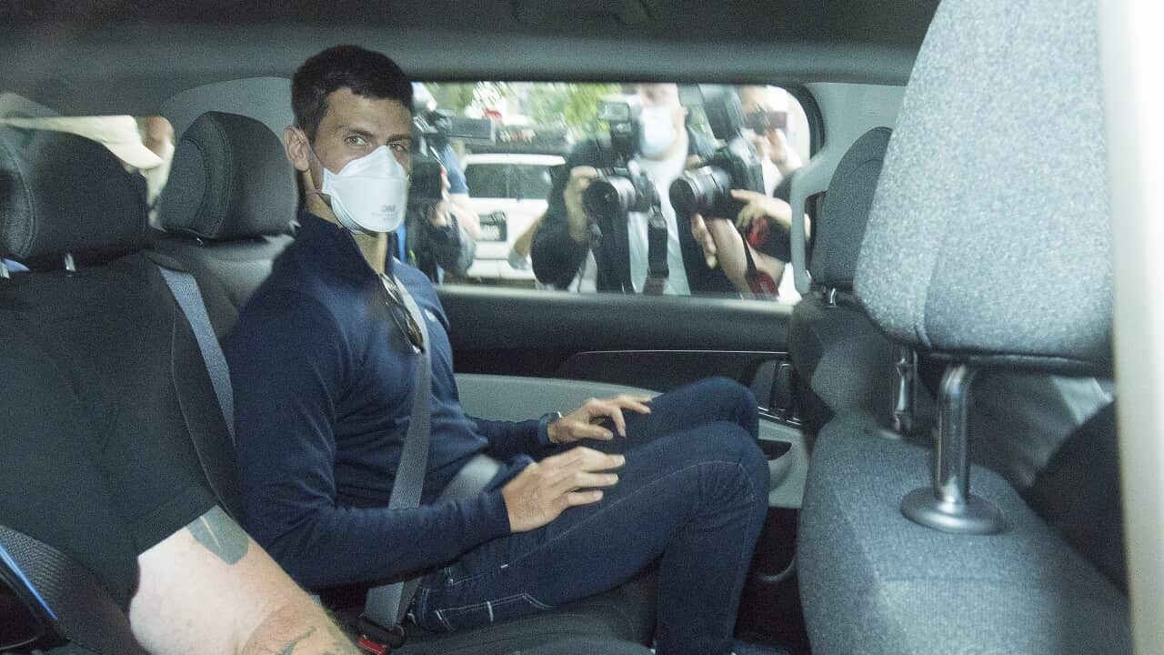 Serbian tennis player Novak Djokovic (centre) departs from the Park Hotel