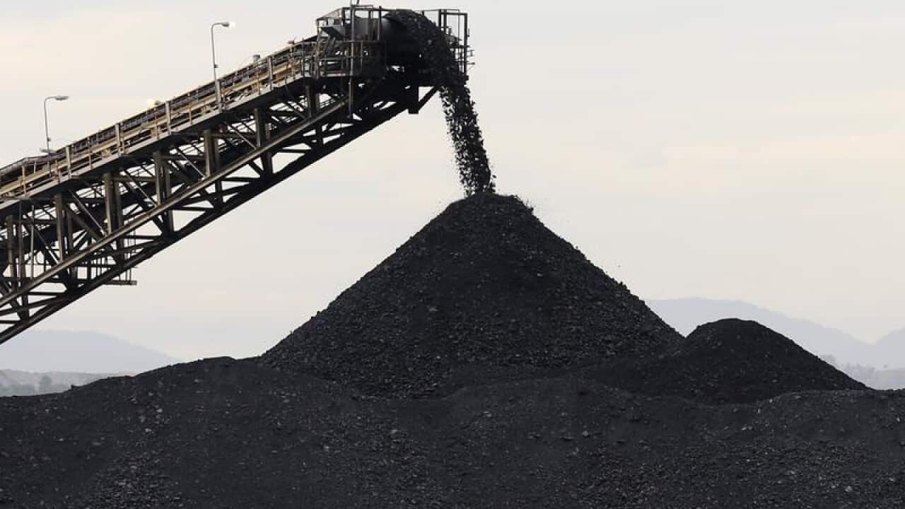 A stock image of coal being stockpiled