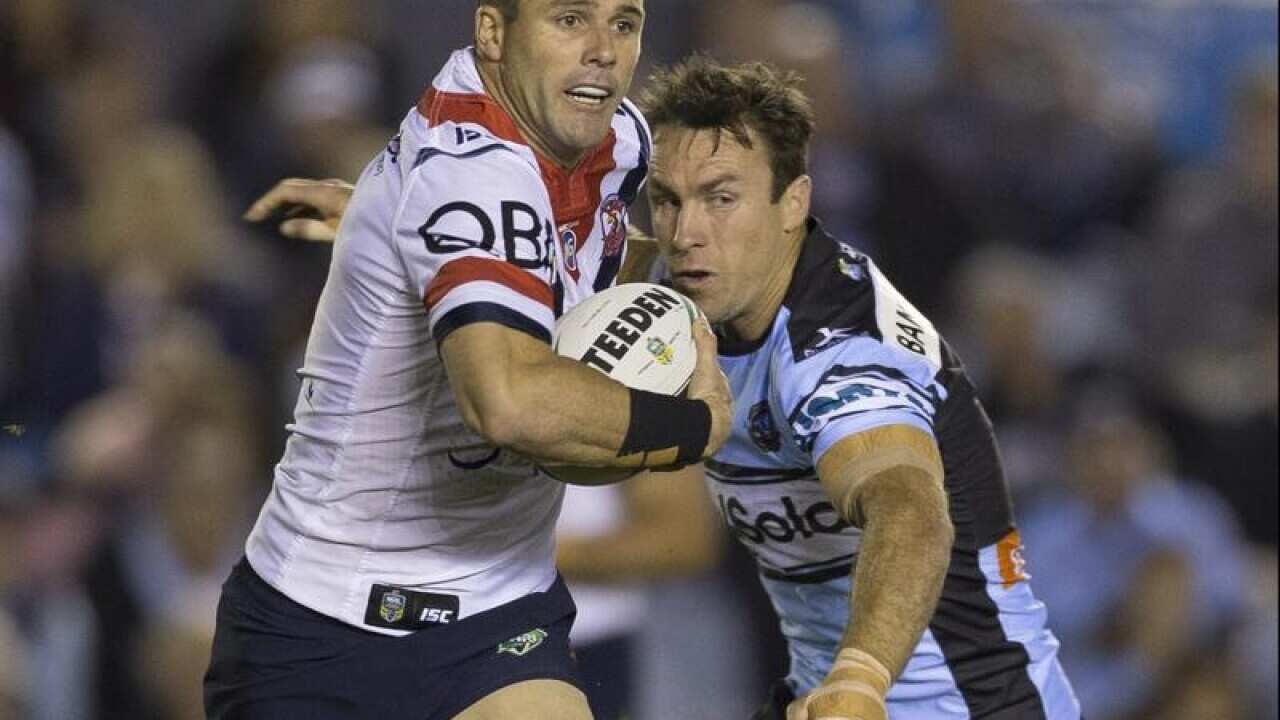 Michael Gordon of the Roosters beats James Maloney of the Sharks