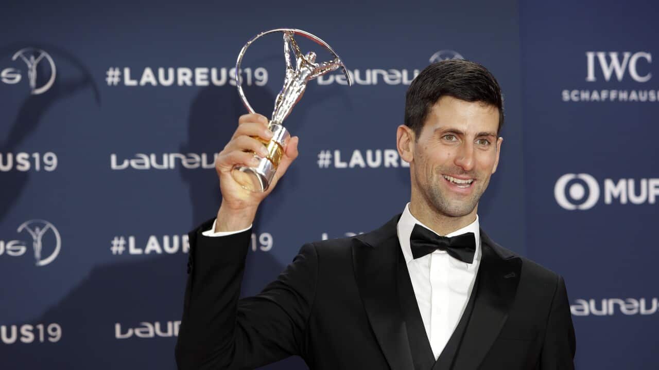 Serbian tennis player Novak Djokovic winner of the World Sportsman of the Year award holds his trophy during the 2019 Laureus World Sports Awards