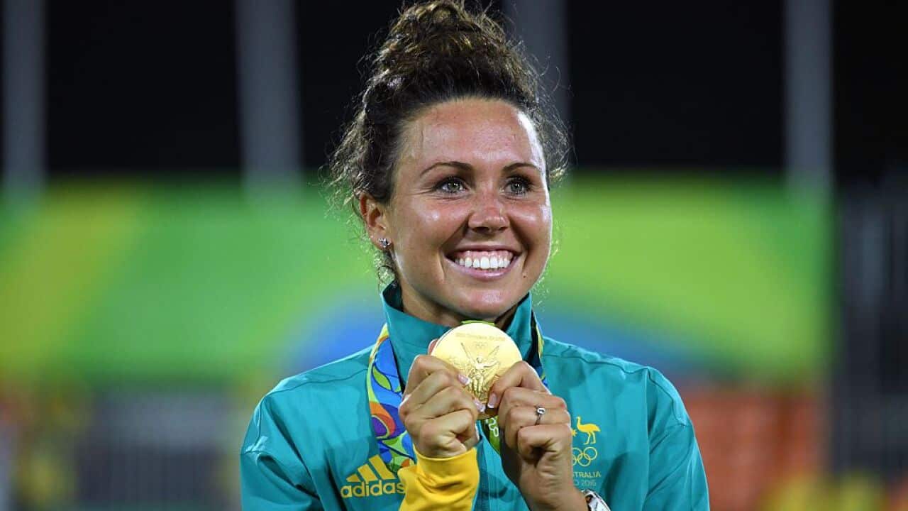 Chloe Esposito poses with her gold medal in the women's modern pentathlon at the Deodoro Stadium
