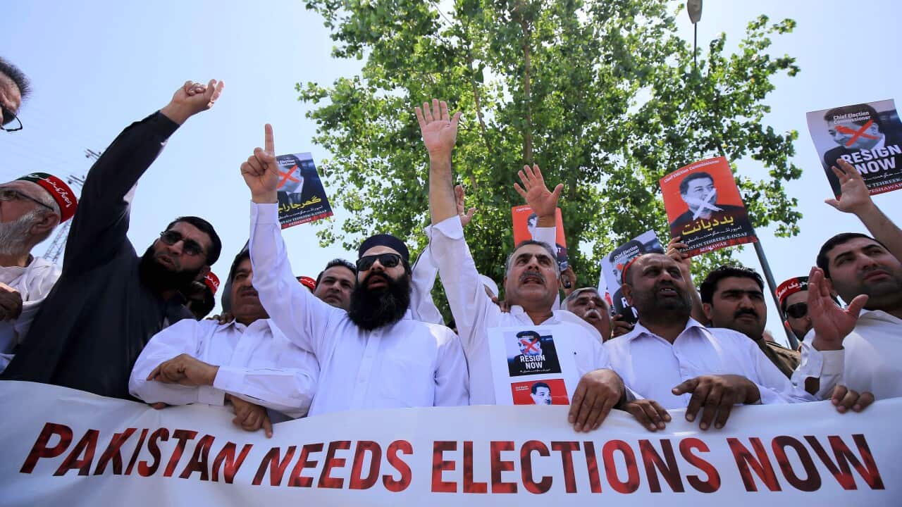 Supporters of political party Pakistan Tehrik-e-Insaf, shout slogans outside the election commission of pakistan (ECP) office.