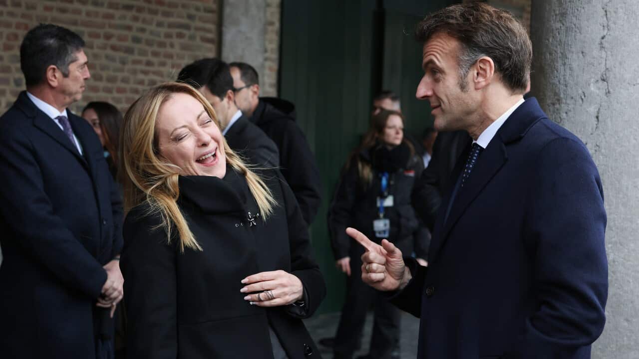 Italy's Prime Minister Giorgia Meloni, center, speaks with French President Emmanuel Macron, right, during the EU summit at Alden Biesen Castle in Bilzen-Hoeselt, Belgium, Thursday, Feb. 12, 2026