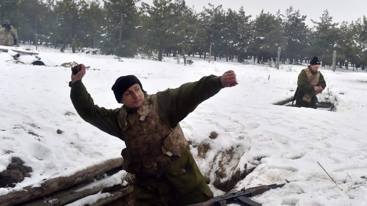 Ukrainian reserve officers called up during the fourth wave of partial mobilisation take part in military exercises in the Army Training Center near the village of Desna, Chernigiv region, on February 13, 2015.