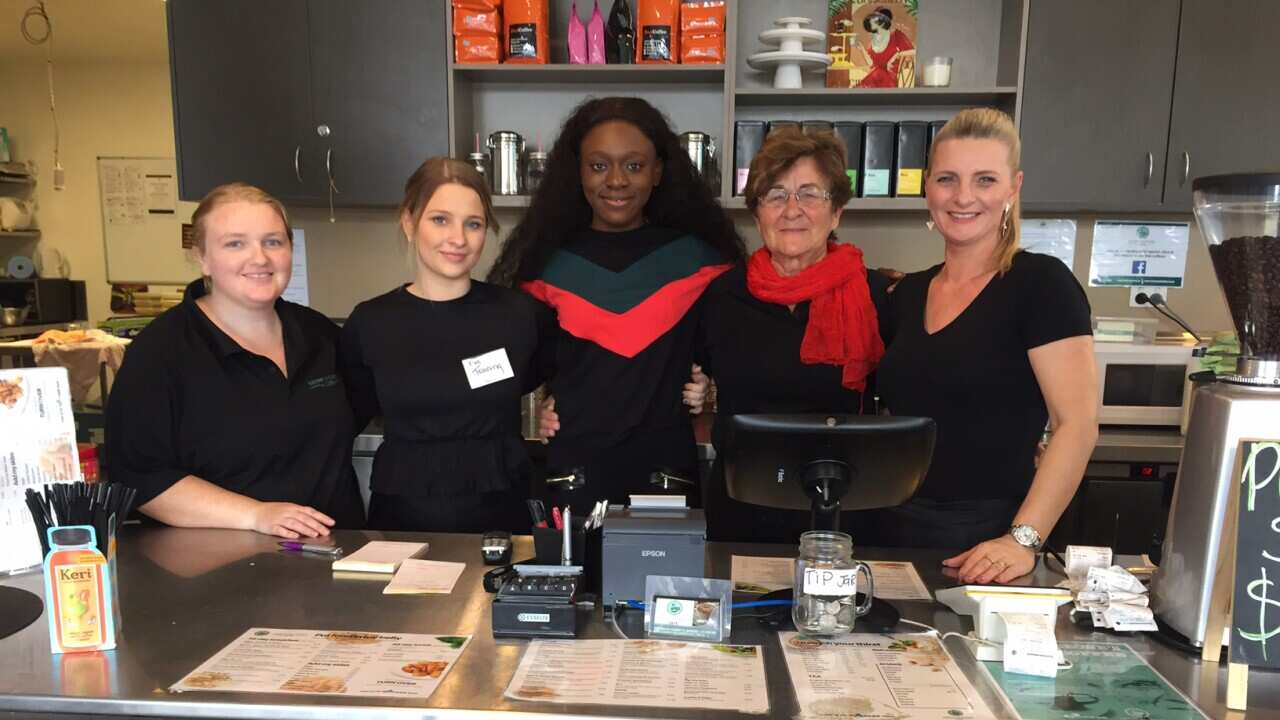 Pemba and her former colleagues at the Harmony on Carmody Cafe