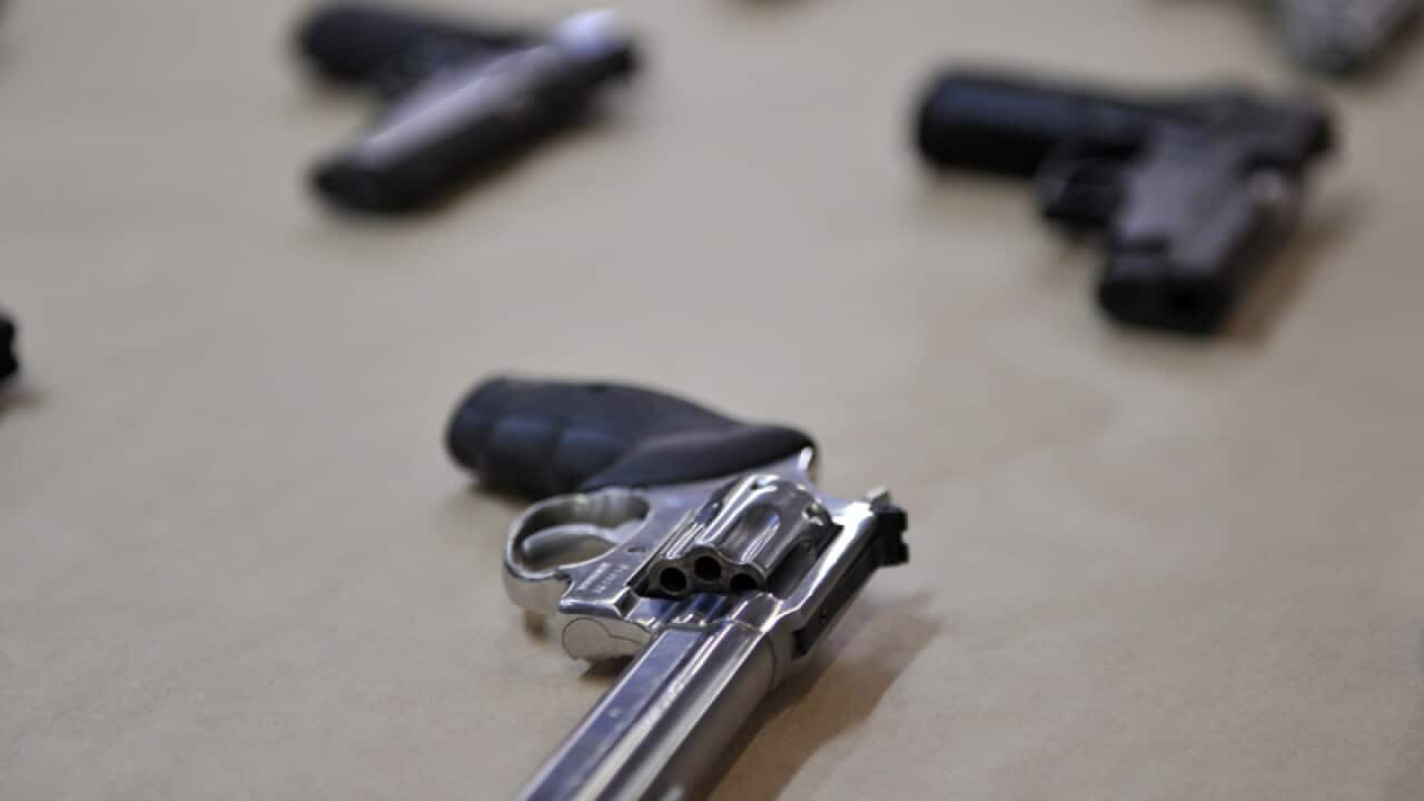 A selection of hand guns are displayed at the Police Centre in Sydney