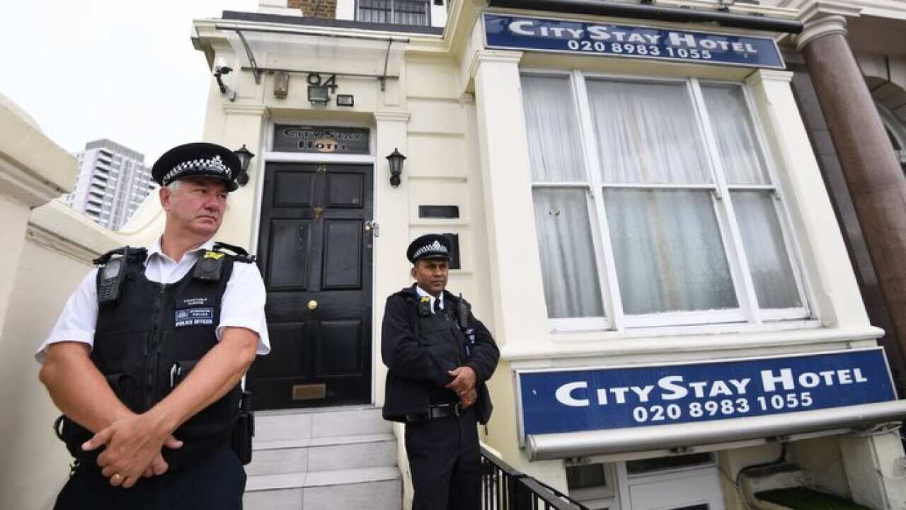 Police stand guard outiside the City Stay hotel in Bow, where Russians Alexander Petrov and Ruslan Boshirov stayed during the Salisbury poison attack.