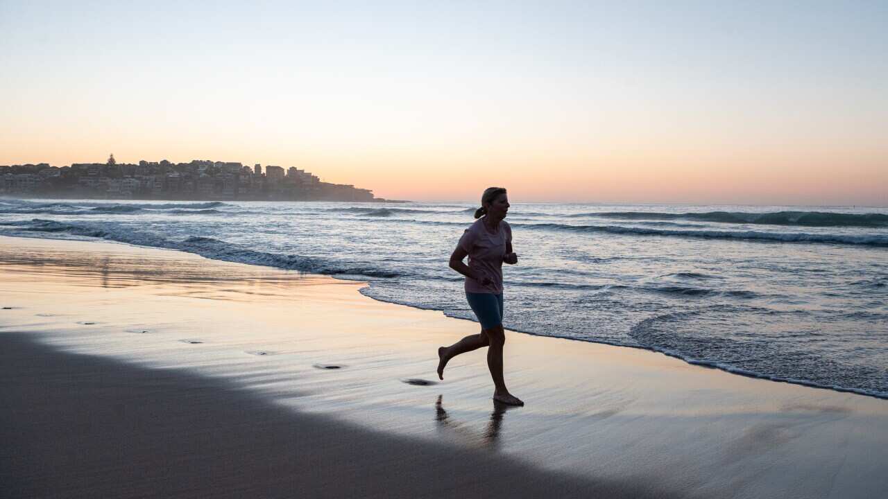 A woman running on the beach