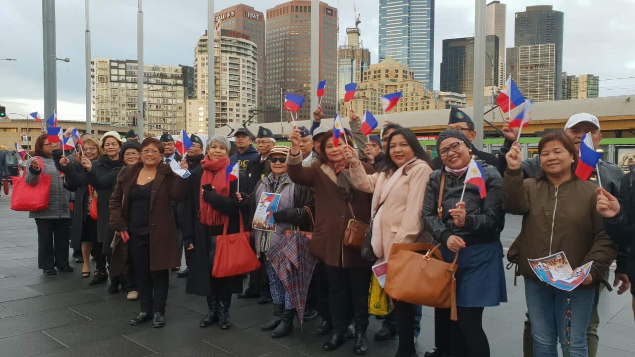 Filipinos from various community groups join in the flag-raising ceremony