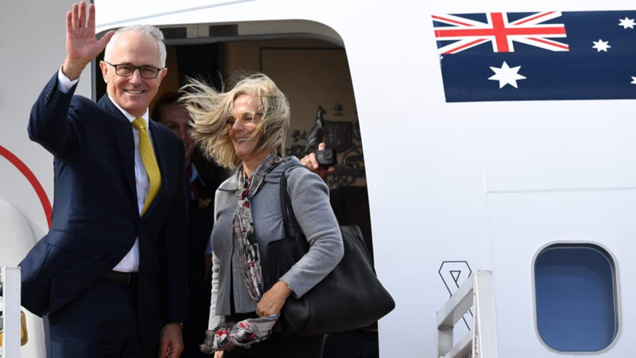 Malcolm Turnbull and Lucy Turnbull board an airplane
