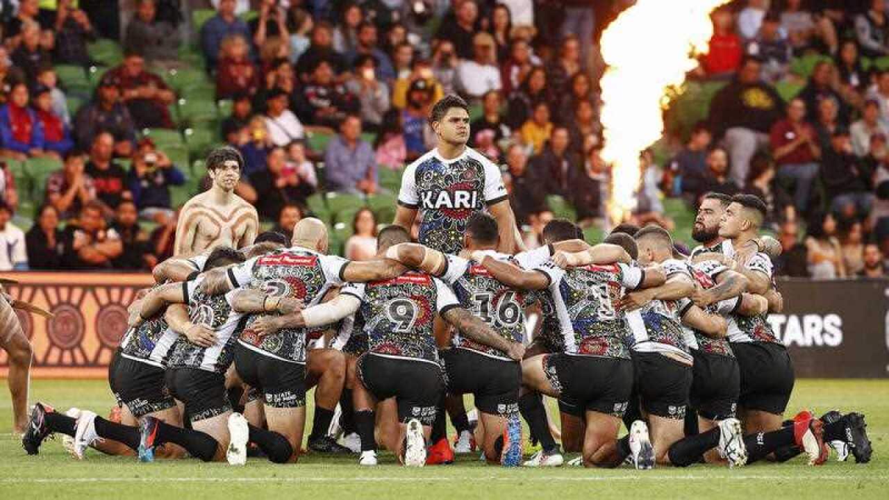 Indigenous players perform a traditional war cry during the NRL Indigenous All-Stars vs Maori All Stars match at AAMI Park, Melbourne, Friday, February 15, 2019.