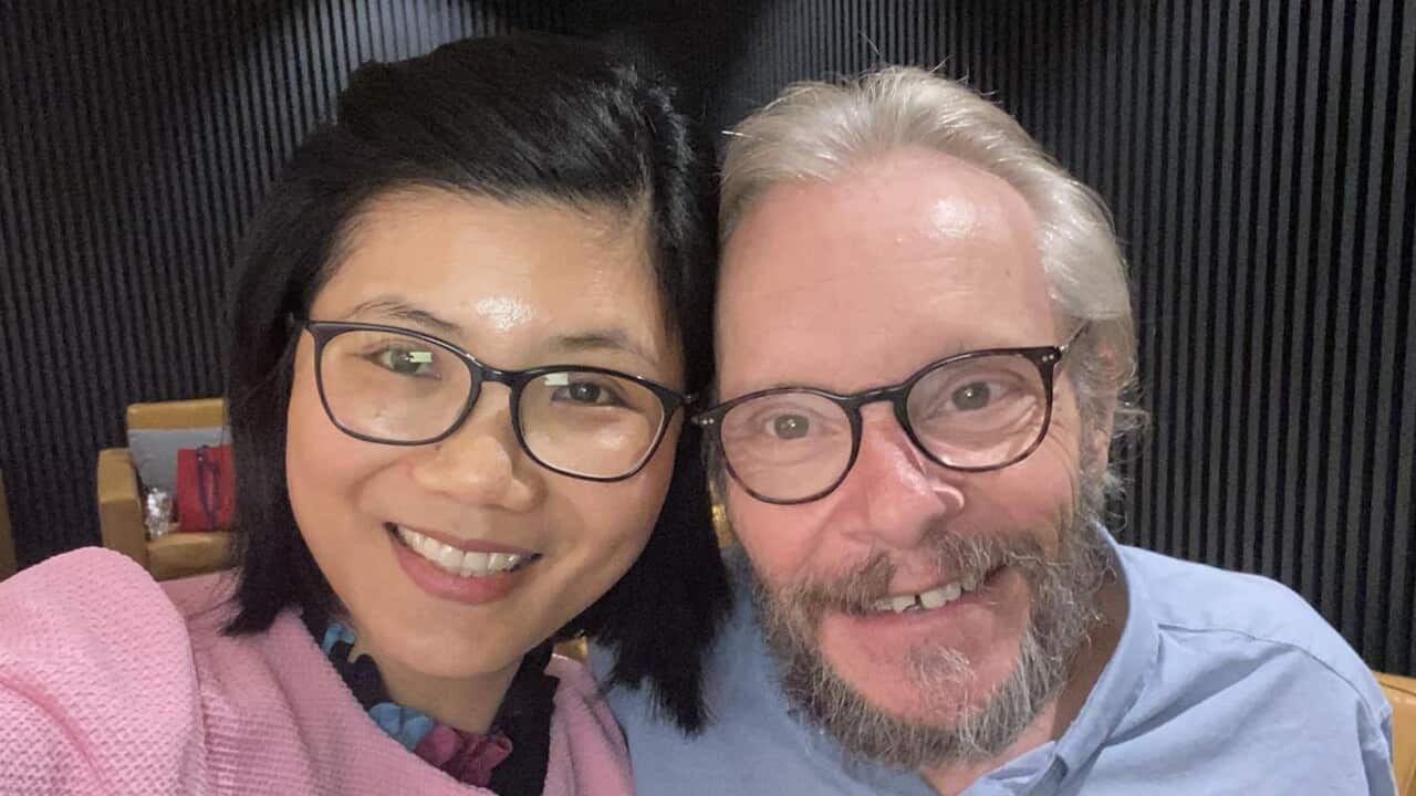 A woman and man take a selfie