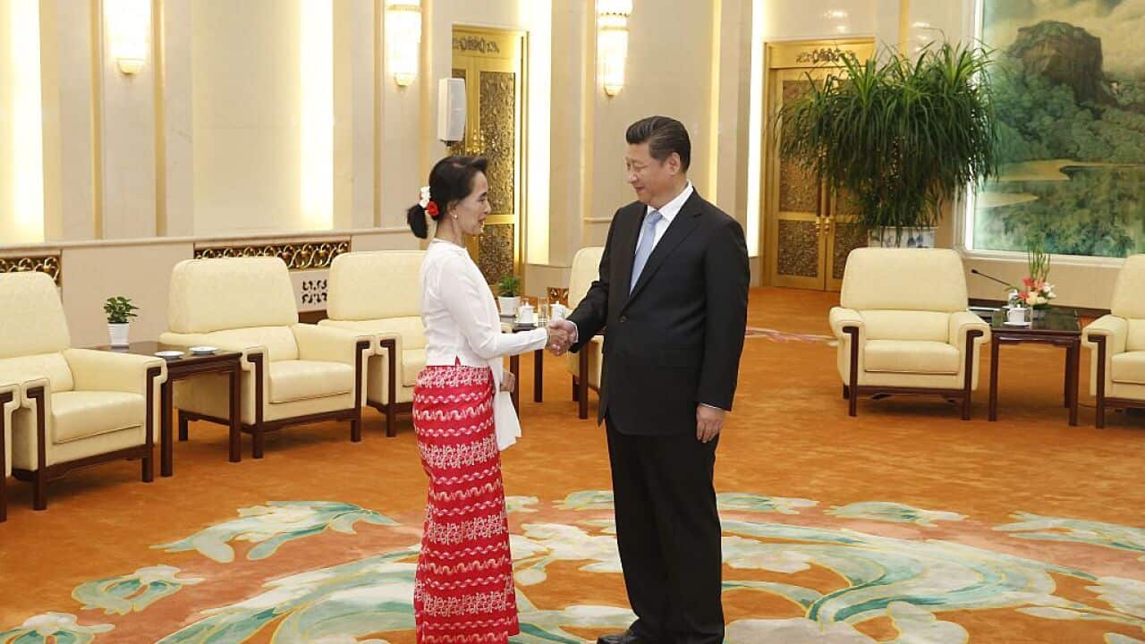 Chinese president Xi Jinping and Myanmar's pro-democracy leader Aung San Suu Kyi shake hands in Beijing in this file photo.