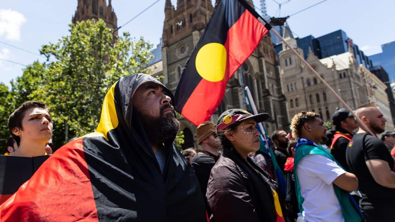 People attend the Invasion Day rally in Melbourne.